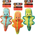 Three star-shaped dog toys in blue, orange, and green with 'Chomper' packaging in the background.