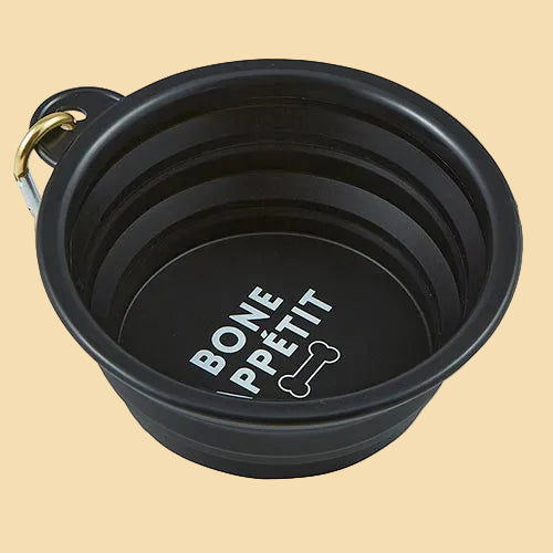 Black collapsible pet bowl with 'Bonne Pétit' text.